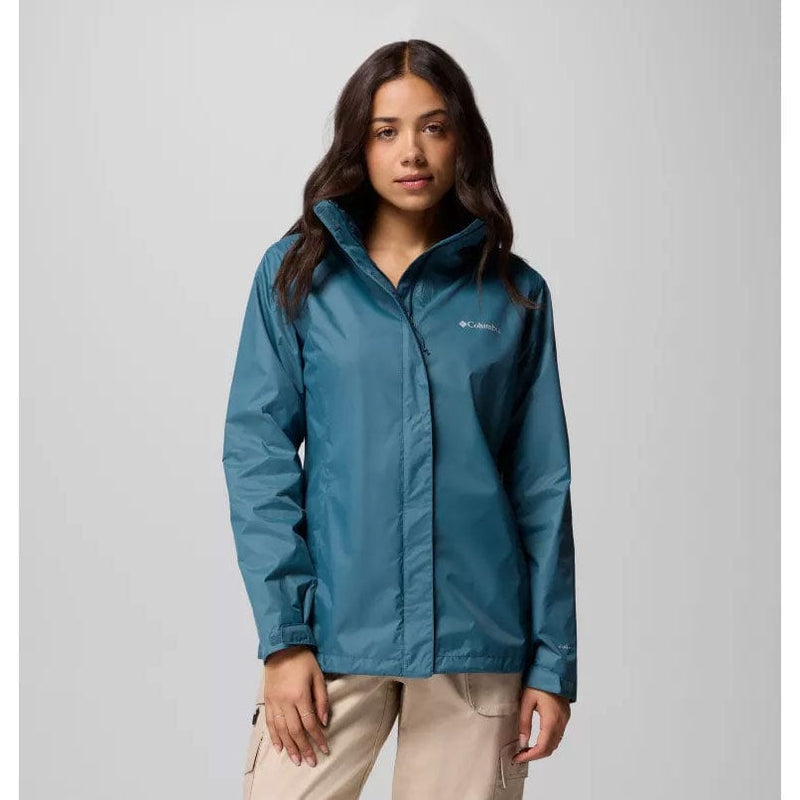 Load image into Gallery viewer, Woman wearing a blue jacket with a visible brand logo on a gray background