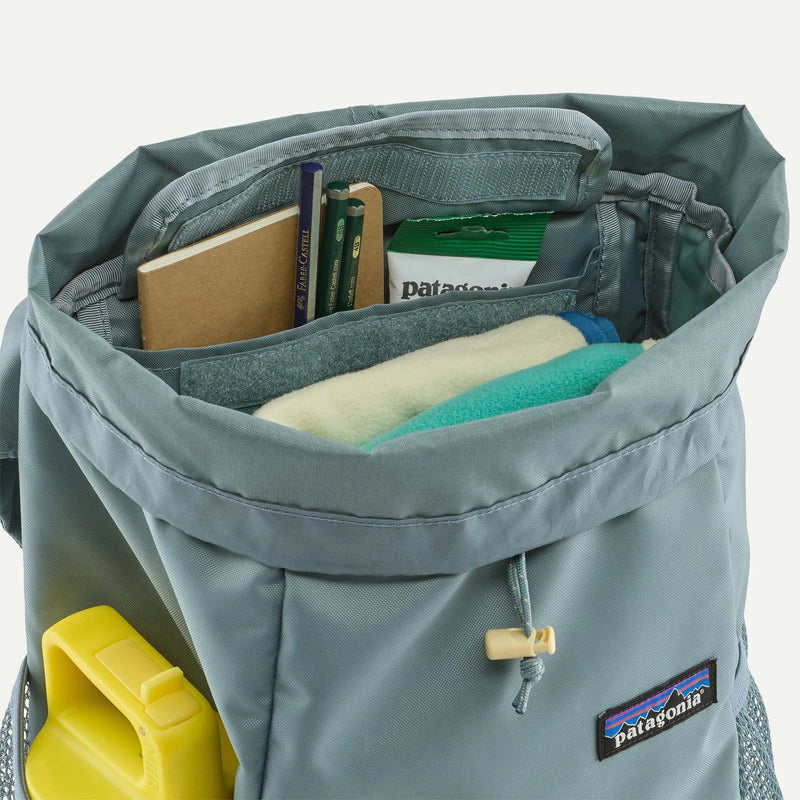 Load image into Gallery viewer, Gray backpack with Patagonia logo open to show items inside on a white background