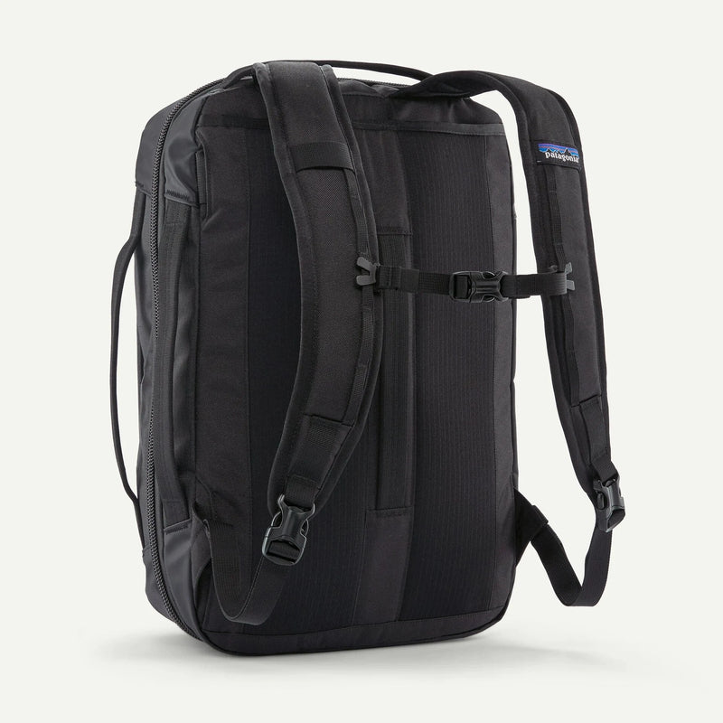 Load image into Gallery viewer, Black backpack with Patagonia logo on a white background