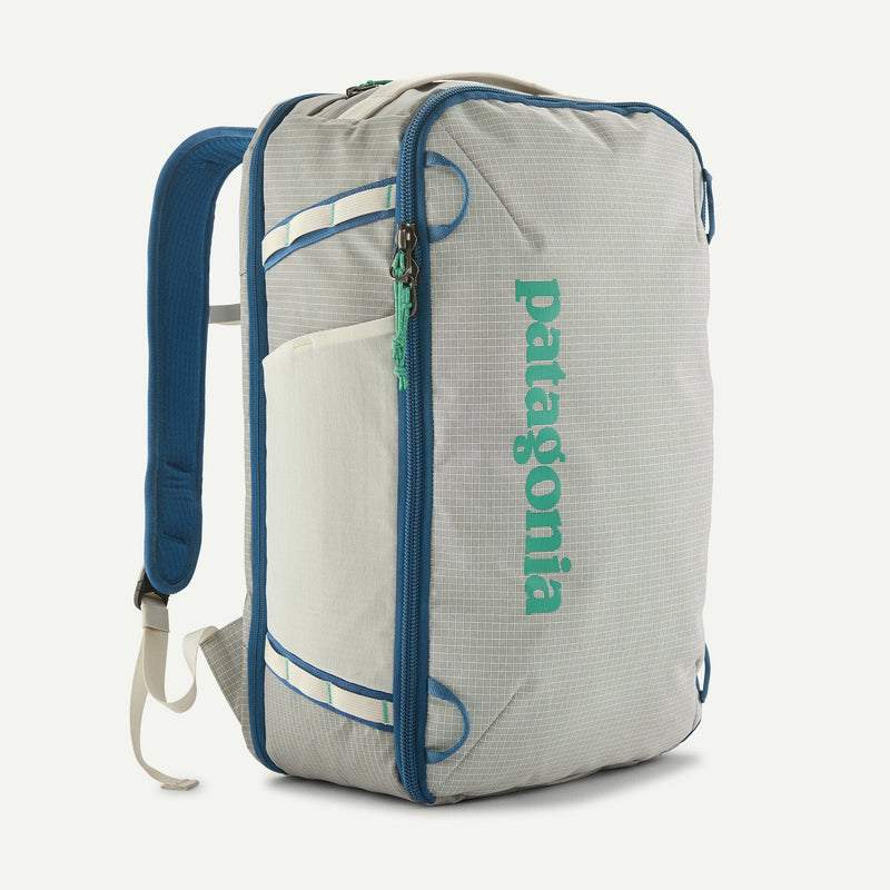 Load image into Gallery viewer, white backpack with blue accents and Patagonia logo