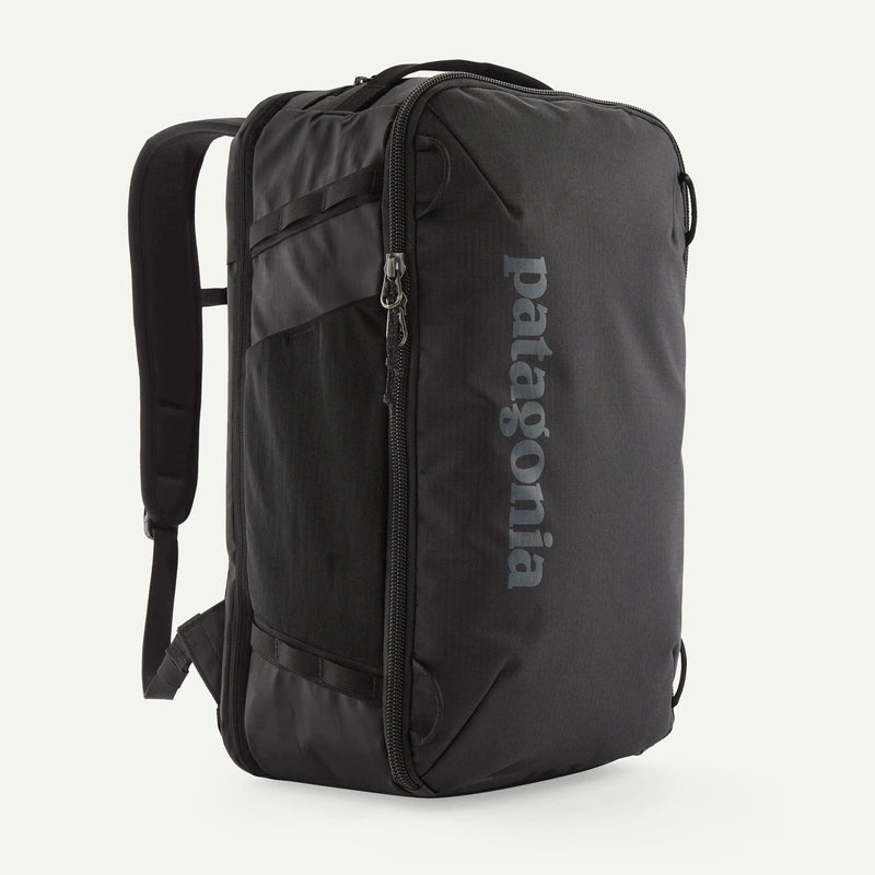 Load image into Gallery viewer, Black backpack with Patagonia logo on a white background