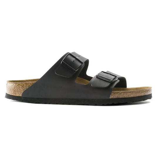 Black sandal with cork insole on a white background