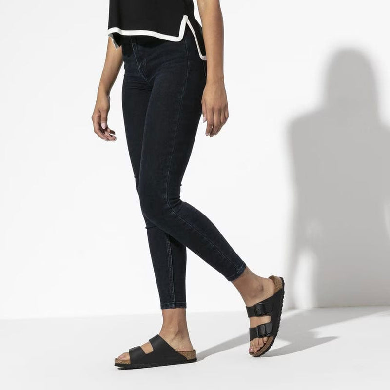 Load image into Gallery viewer, Person wearing black jeans and black sandals on a white background