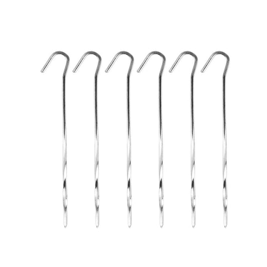 Set of six metal tent stakes on a white background