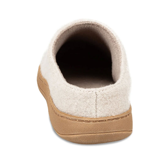 Close-up of a slipper with beige sole and white top on a white background