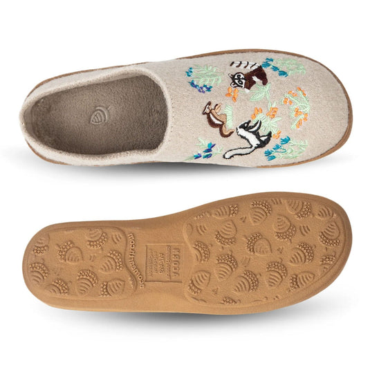Embroidered slipper with a cat design on a beige background