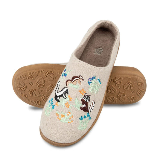 Beige slipper with embroidered animal designs on a white background