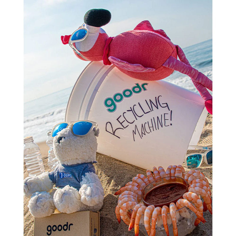 Load image into Gallery viewer, goodr recycling machine on a beach with stuffed animals and ocean-themed decor.
