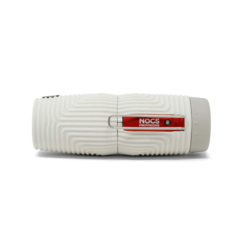 Load image into Gallery viewer, A white cylindrical portable device with a ribbed textured surface and a red accent band in the center featuring the white text 'NOCS PROVIDENS'.