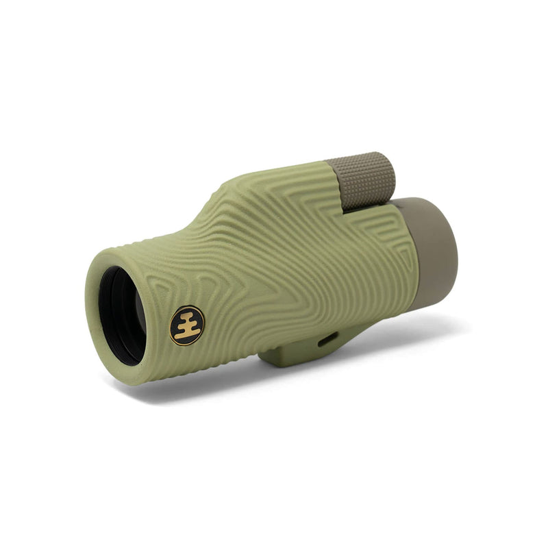 Load image into Gallery viewer, A single-lens spotting scope with a textured olive green body, featuring a gold and black logo emblem on the side, a ribbed grip, and a gray eyepiece mount, shown on a white background.