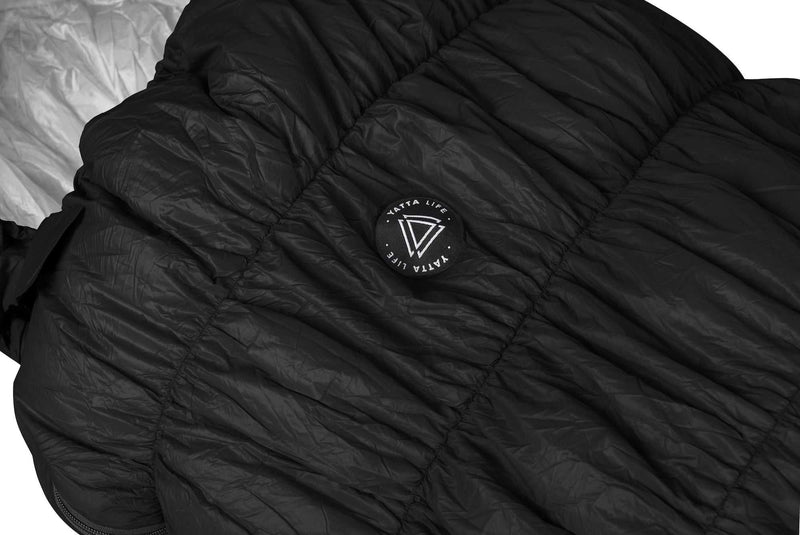 Load image into Gallery viewer, Black goose down sleeping bag with Yatta Life logo, durable nylon fabric, designed for all-season comfort and warmth.