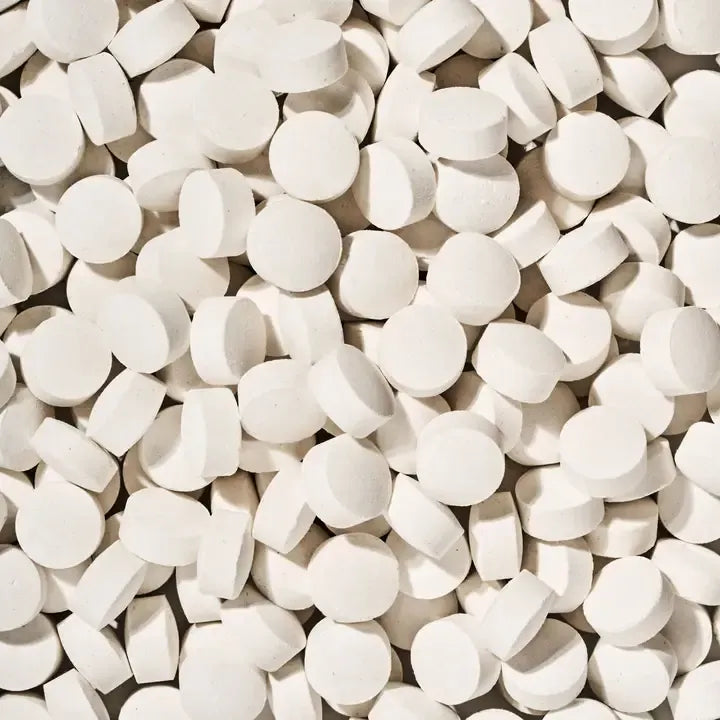 Load image into Gallery viewer, Close-up of a large pile of white tablets.