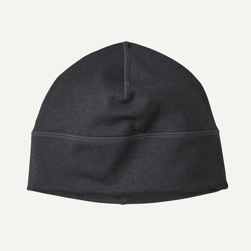 Load image into Gallery viewer, Black beanie on a light gray background