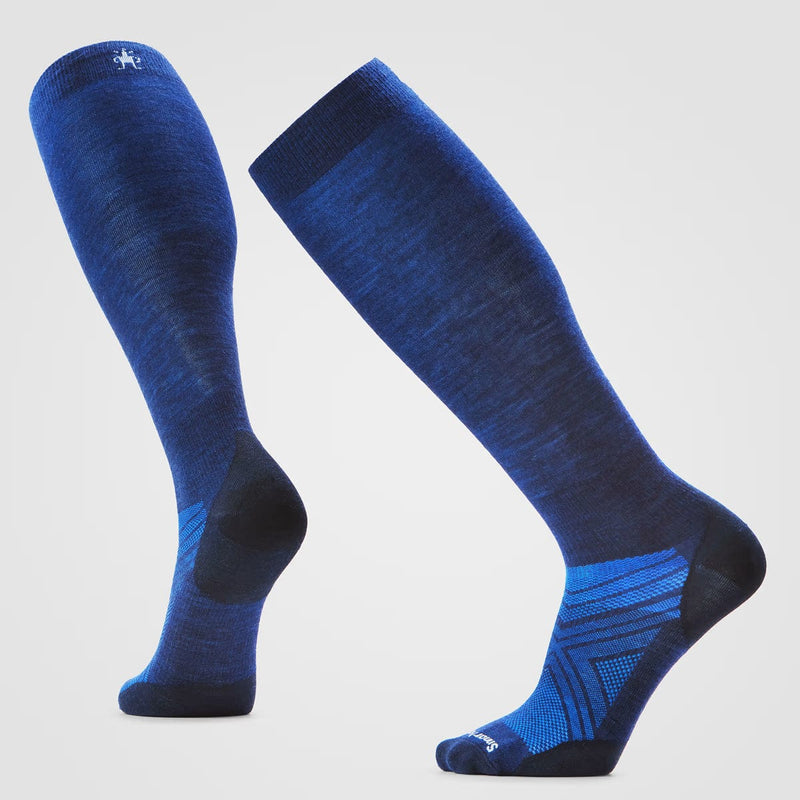 Load image into Gallery viewer, Pair of blue knee-high socks on a light gray background