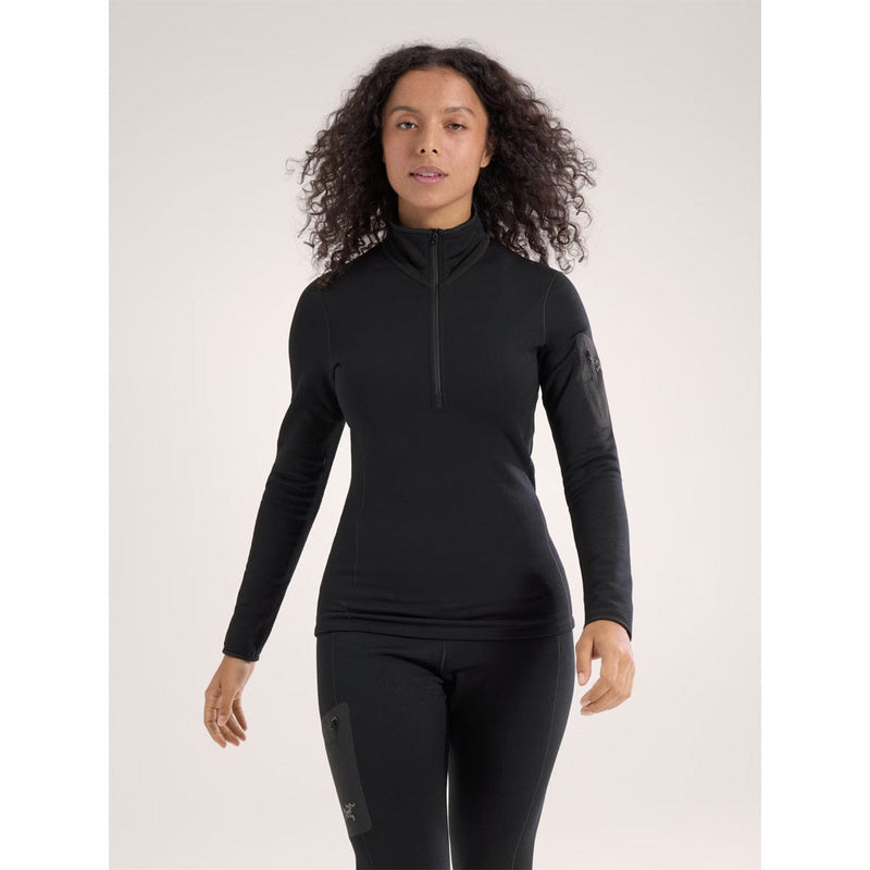 Load image into Gallery viewer, Woman wearing a black long-sleeve top with a zipper on a light pink background