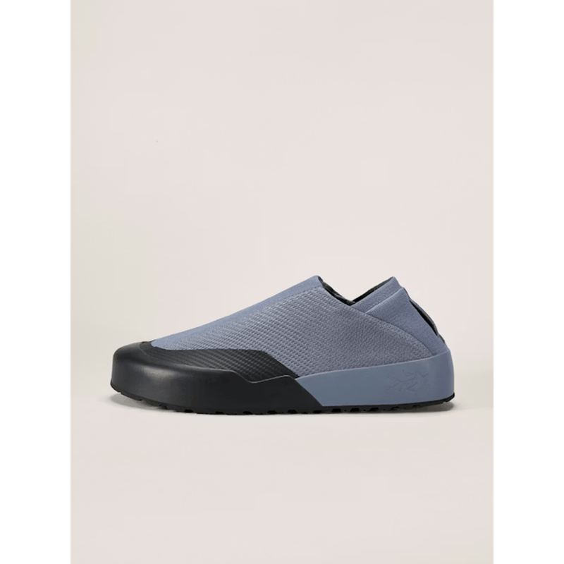 Load image into Gallery viewer, Blue slip-on shoe with black sole on a light beige background
