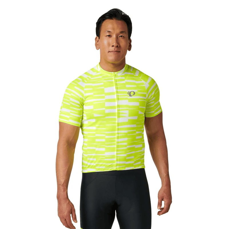 Load image into Gallery viewer, Man wearing a bright yellow and white cycling jersey on a white background