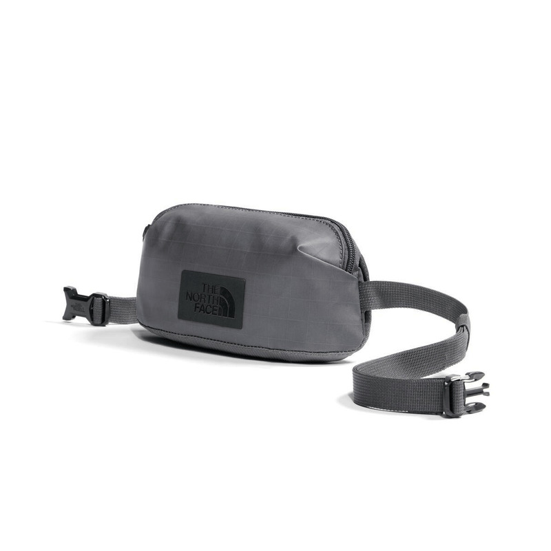 Load image into Gallery viewer, Gray waist bag with The North Face logo on a white background