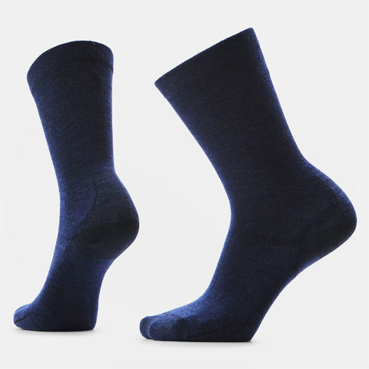 Pair of dark blue socks on a light gray background
