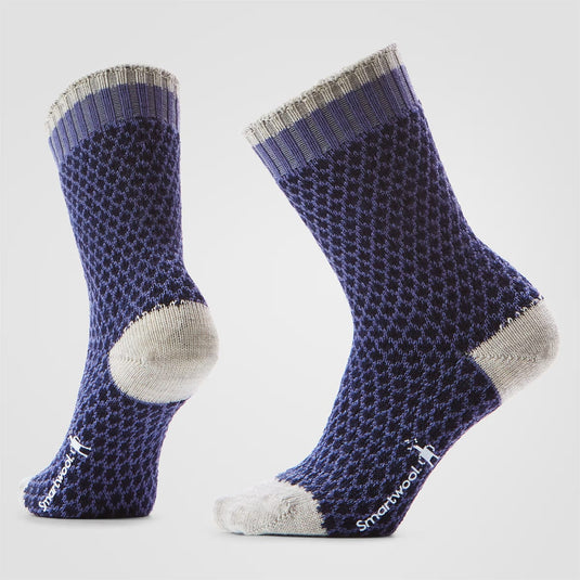 Pair of purple and gray patterned socks on a light gray background
