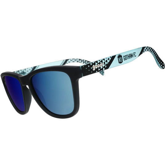 Sunglasses with blue lenses and patterned arms on a white background