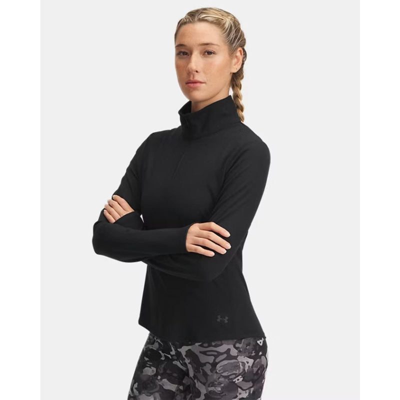 Load image into Gallery viewer, Woman wearing a black long-sleeve athletic top with camouflage leggings on a white background
