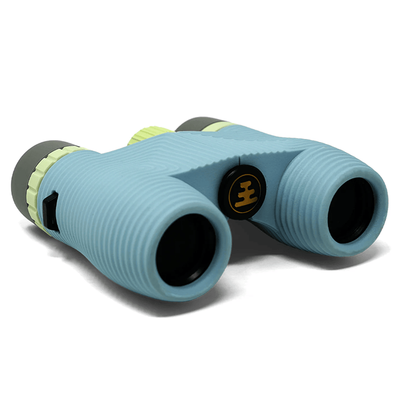 Load image into Gallery viewer, Light blue silicone binocular protective cover with lime green accents and a black center logo, shown on a white background.