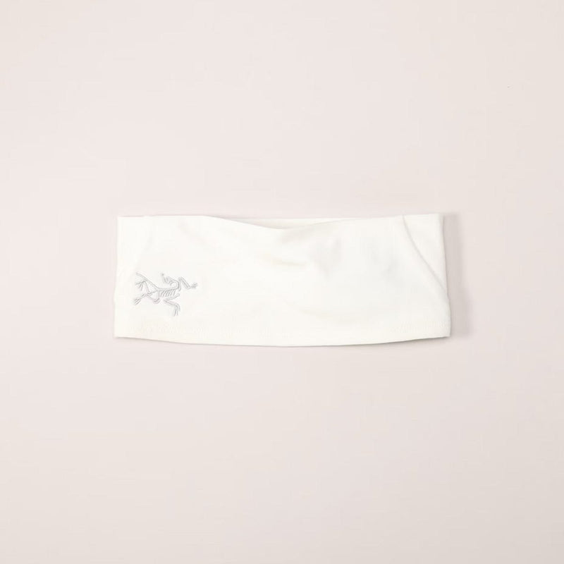 Load image into Gallery viewer, White headband with a logo on a light pink background