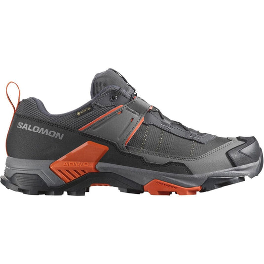 Gray and orange Salomon hiking shoe on a white background