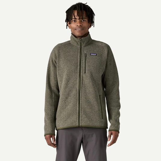Person wearing a Patagonia jacket on a white background