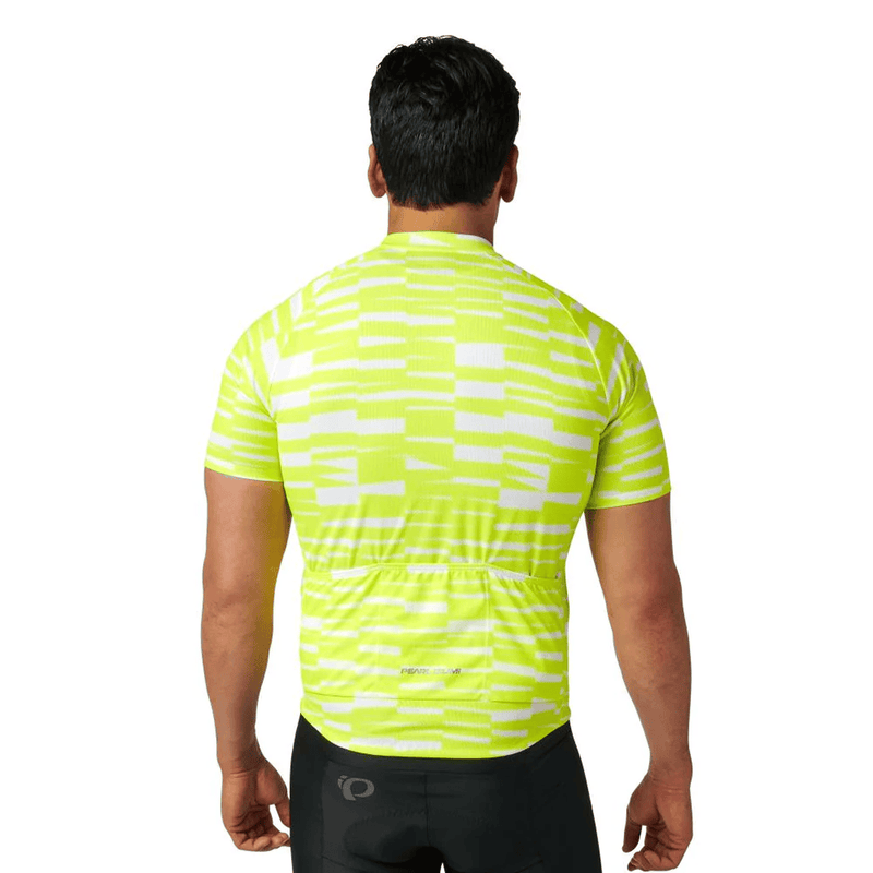 Load image into Gallery viewer, Person wearing a bright yellow cycling jersey with a subtle pattern on a white background
