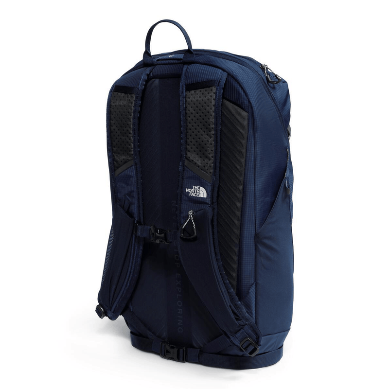 Load image into Gallery viewer, Navy blue backpack with The North Face logo on a white background