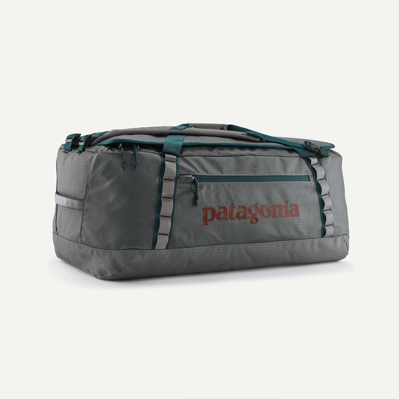 Load image into Gallery viewer, Gray duffel bag with Patagonia logo on a white background