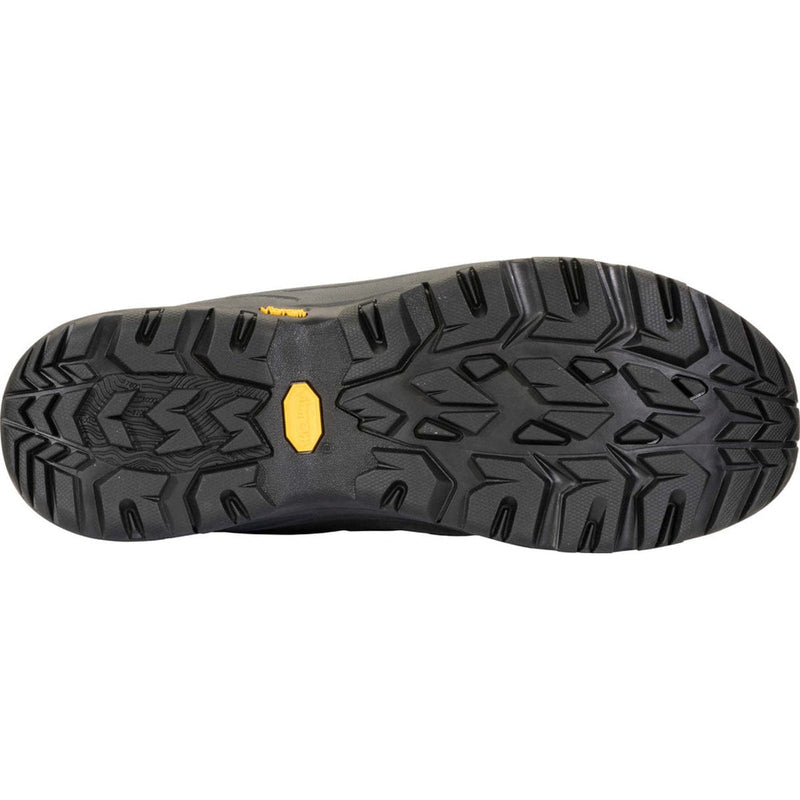 Load image into Gallery viewer, Close-up of a black shoe sole with a yellow label on a white background