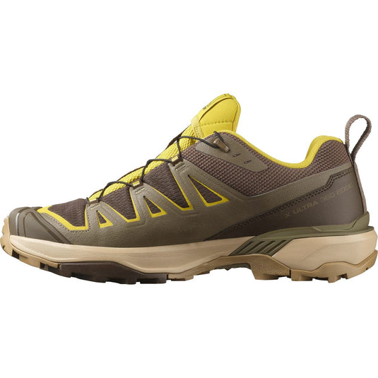 Brown and yellow hiking shoe on a white background