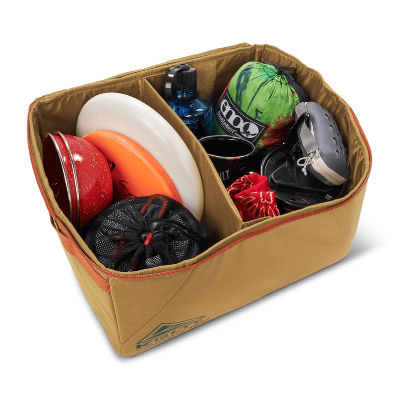 Load image into Gallery viewer, Brown bag filled with various items including colorful bottles and bags on a white background