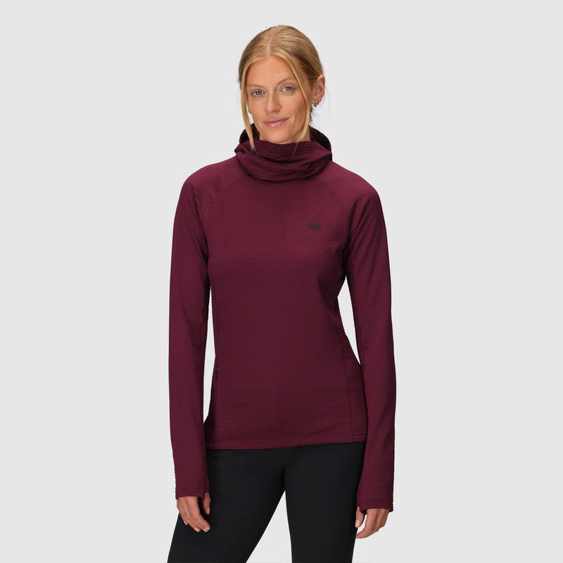 Load image into Gallery viewer, Woman wearing a maroon long-sleeve top with a high collar on a light gray background