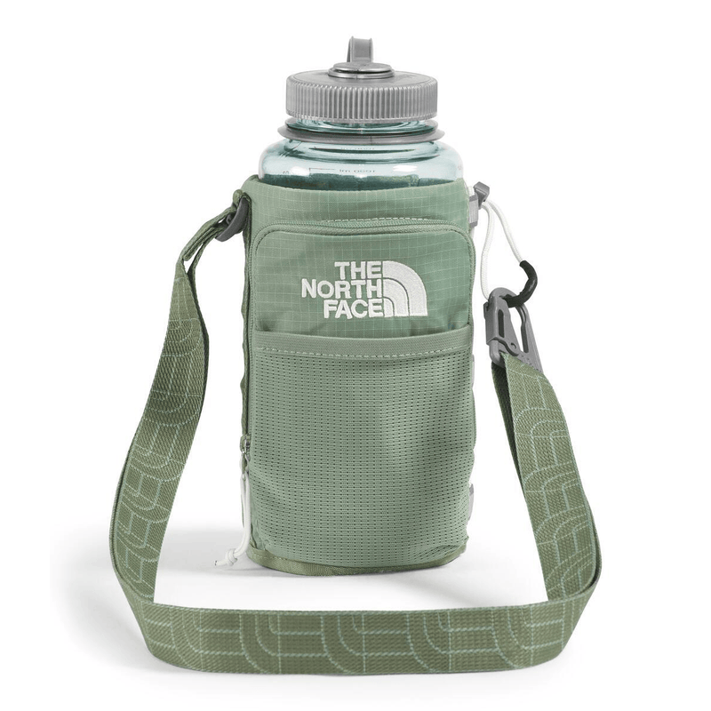 Load image into Gallery viewer, Green water bottle holder with strap featuring The North Face logo on a white background