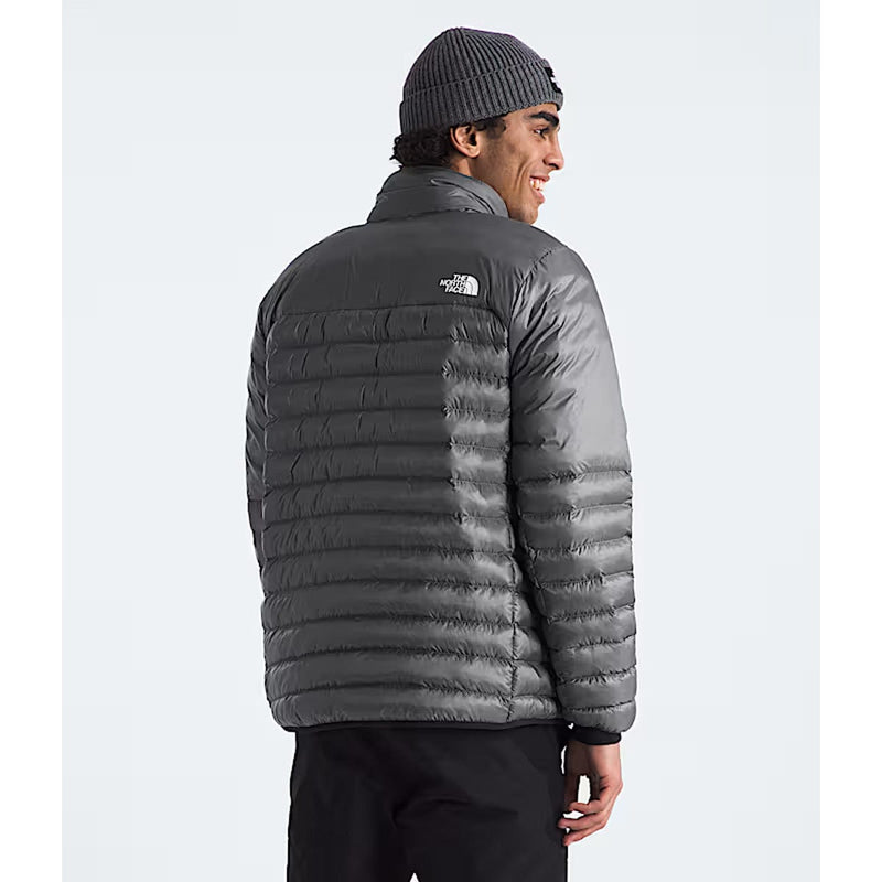 Load image into Gallery viewer, Person wearing a gray puffer jacket with a visible brand logo on a white background