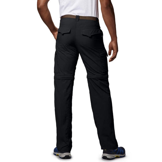 Person wearing black pants on a white background