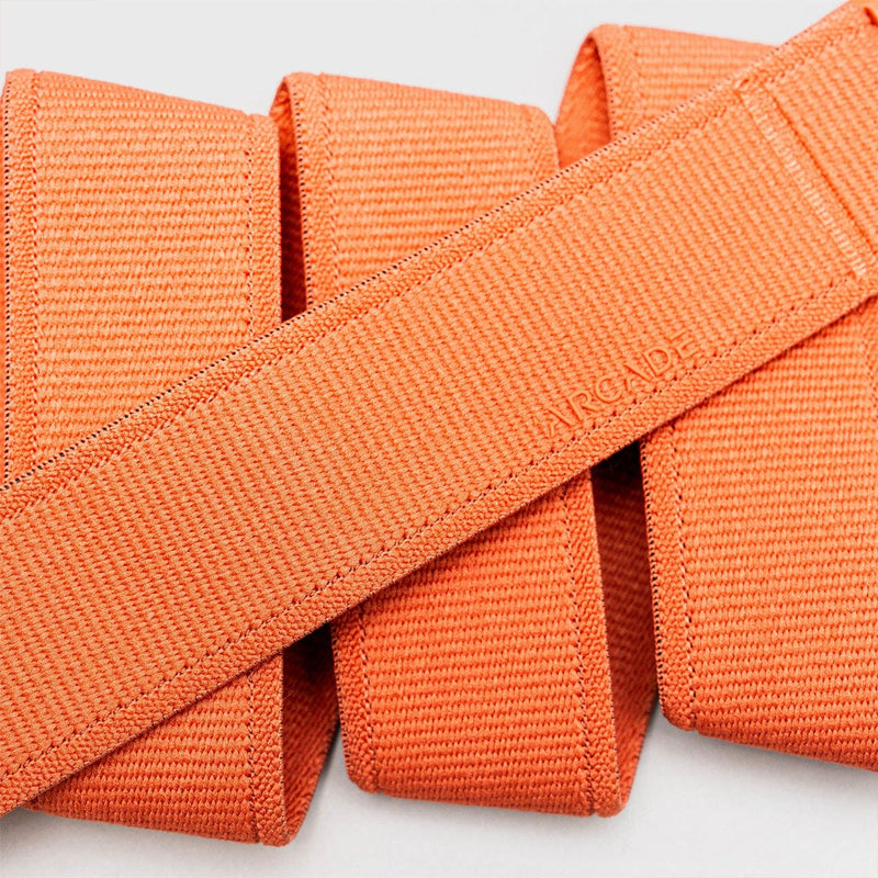 Load image into Gallery viewer, Close-up of orange webbing with a brand logo on a light gray background