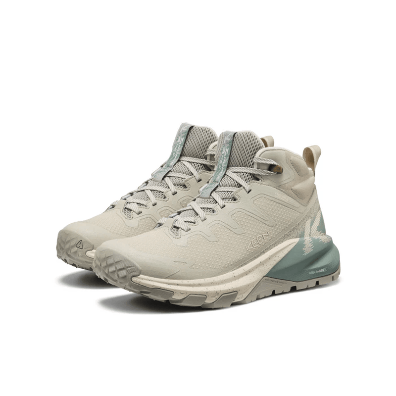 Load image into Gallery viewer, Pair of beige hiking boots with blue accents on a white background