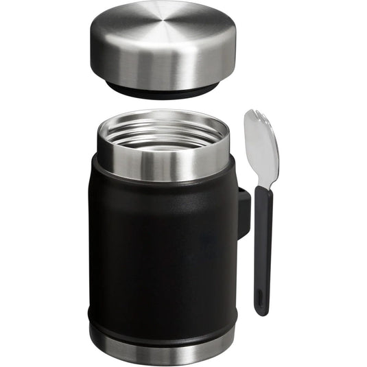 Black insulated mug with silver lid and spoon on a white background
