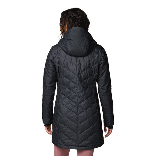 Black quilted coat worn by a person on a white background