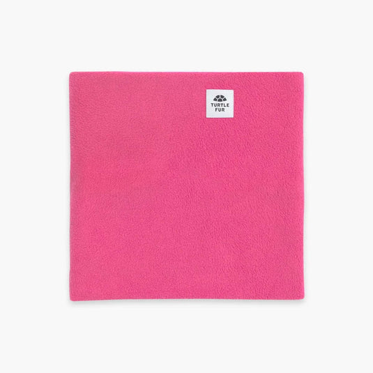 Pink towel with a brand logo on a white background