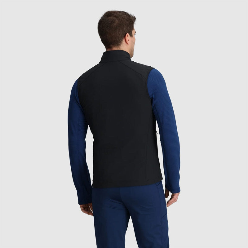 Load image into Gallery viewer, Man wearing a black and blue jacket on a light gray background