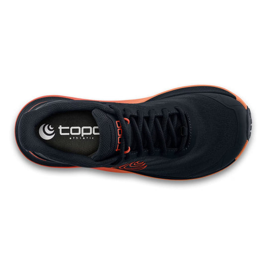 Black athletic shoe with orange accents on a white background