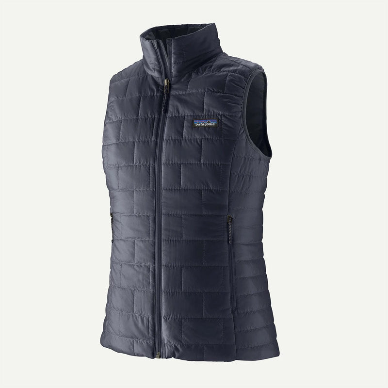 Load image into Gallery viewer, Dark gray quilted vest with Patagonia logo on a white background