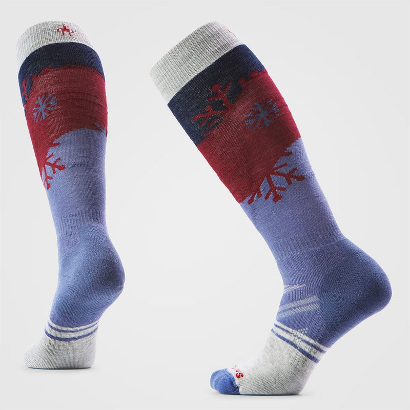 Load image into Gallery viewer, Pair of colorful socks with snowflake design on a light gray background
