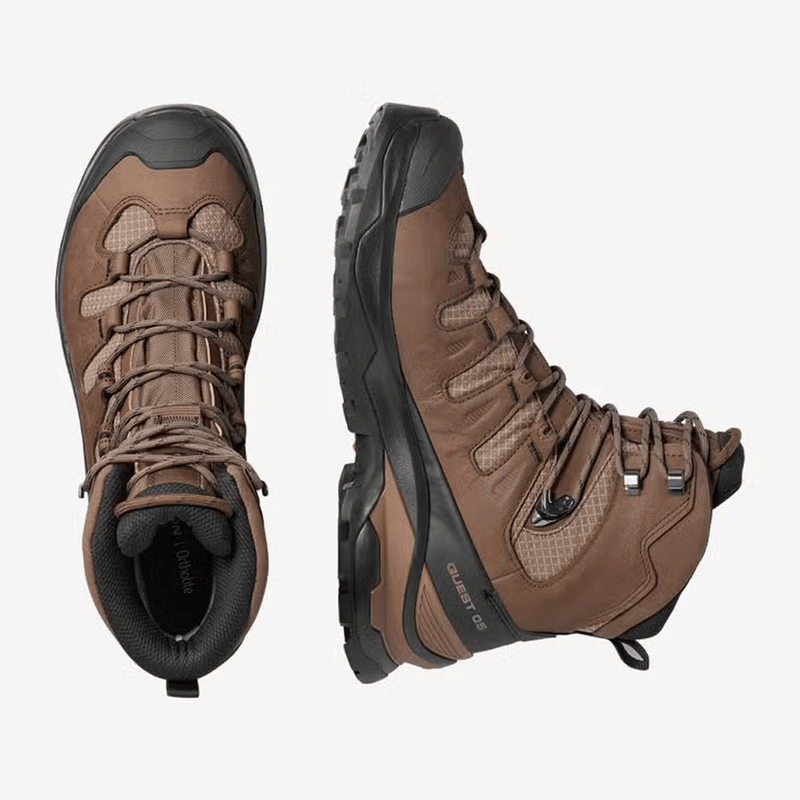 Load image into Gallery viewer, Pair of brown hiking boots with black soles on a white background